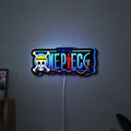One Piece LED lightbox hanging on a wall with blue glow