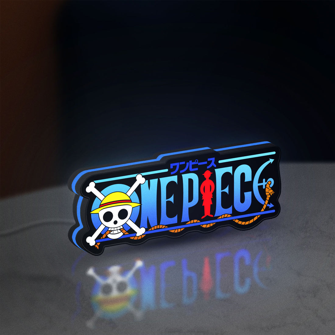 One Piece LED lightbox hanging on a wall with blue glow