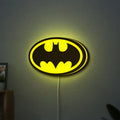 Batman LED lightbox hanging on a wall with yellow glow