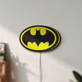 Unlit Batman LED lightbox mounted on a wall in daylight