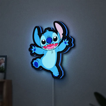 Stitch Happy LED lightbox hanging on a wall with blue glow