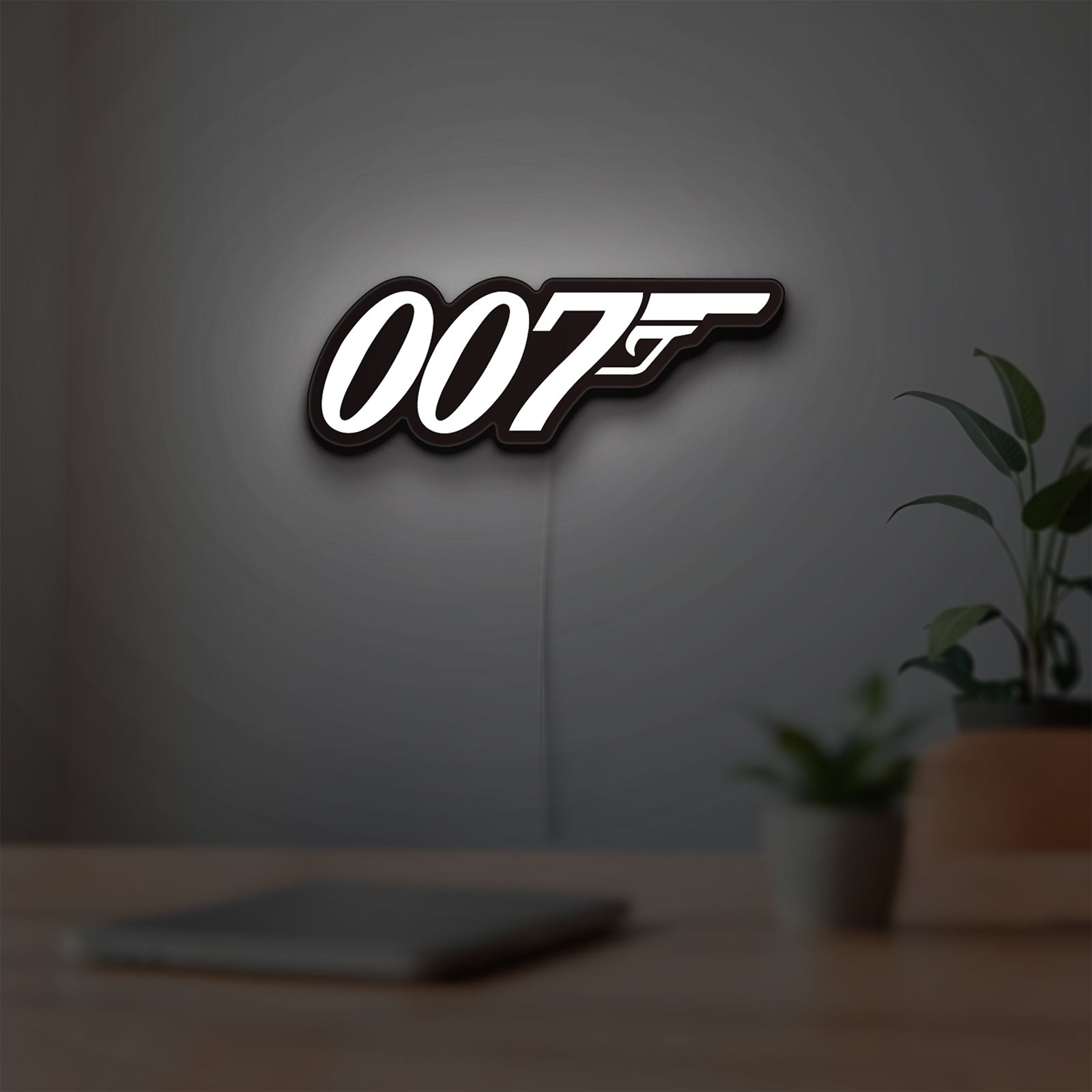 James Bond 007 LED lightbox hanging on a room wall with soft white light