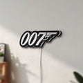 Unlit James Bond 007 LED lightbox mounted on a wall in daylight