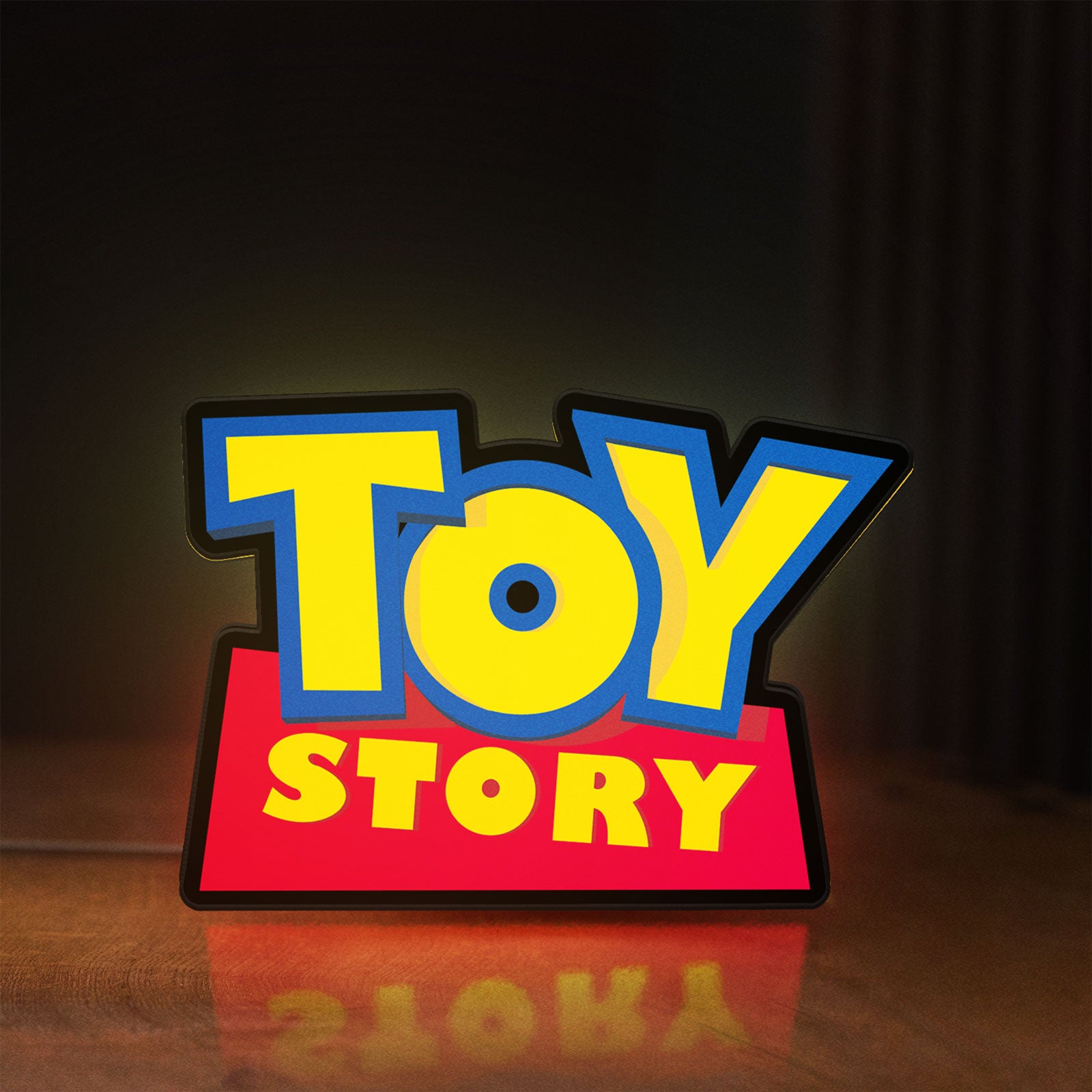 Front view of Toy Story LED lightbox sign glowing on a wooden desk