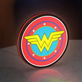 Wonder Woman LED lightbox standing on a desk from an angled side view with red glow