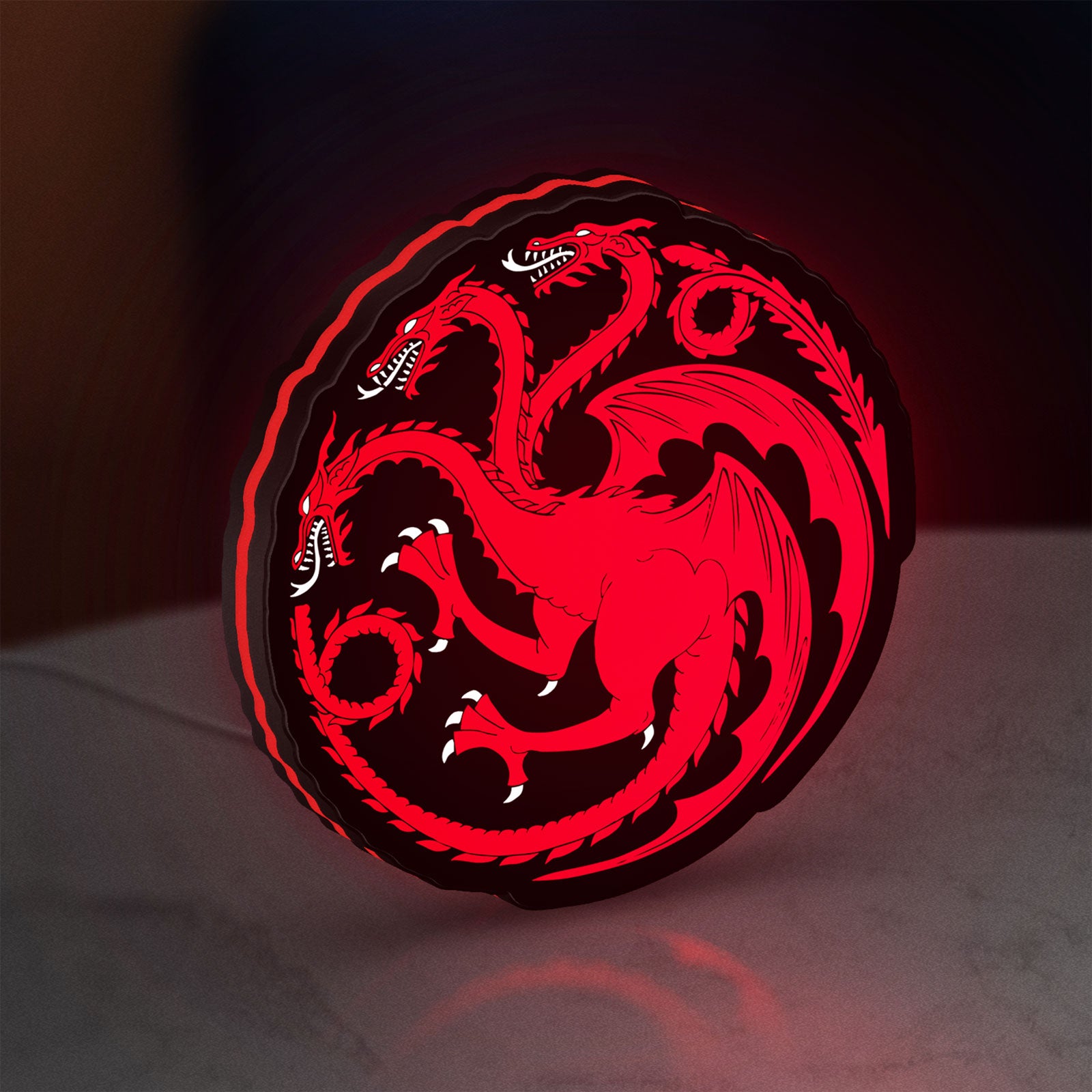 House Targaryen LED lightbox standing on a desk from an angled side view with red glow