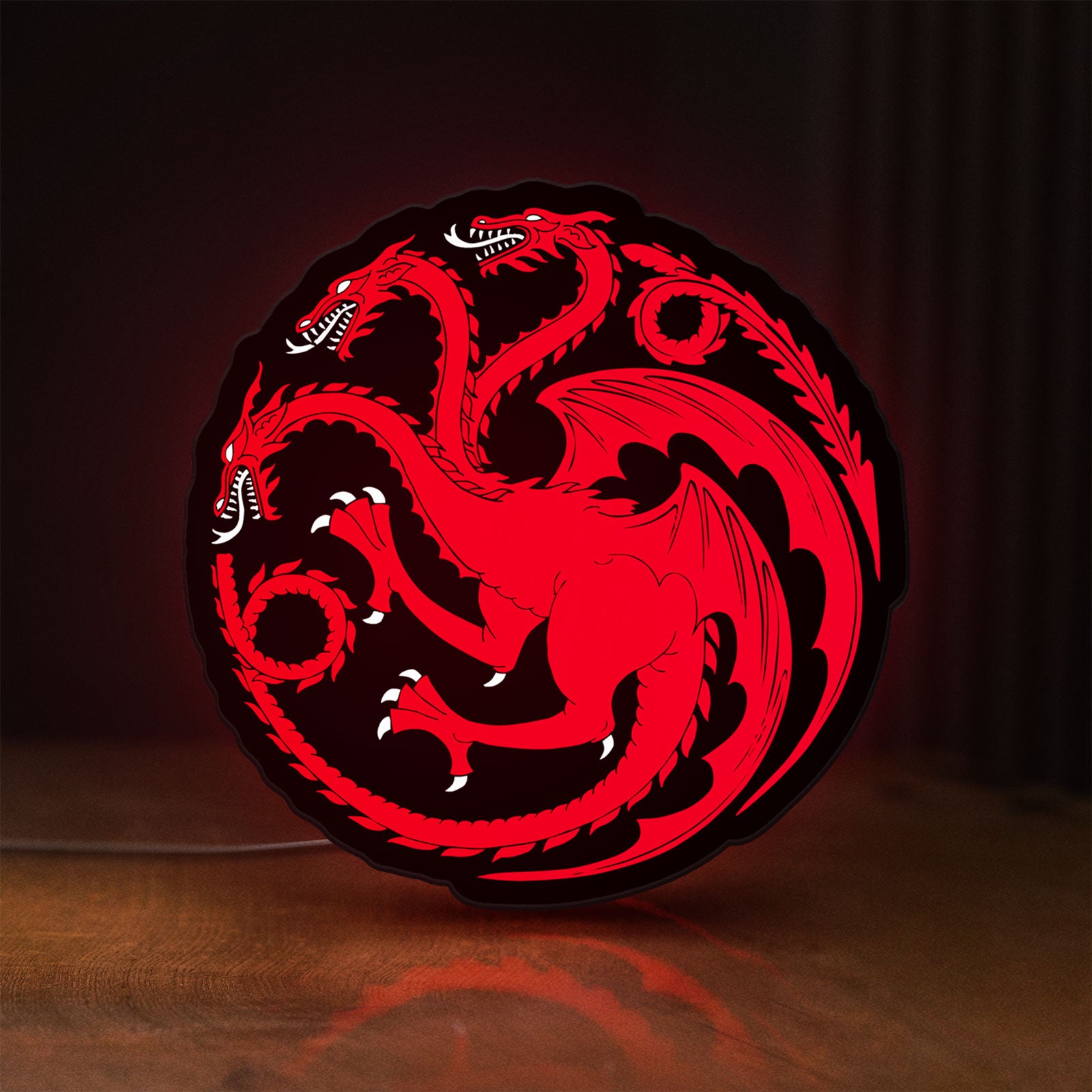 Front view of House Targaryen LED lightbox sign glowing on a wooden desk