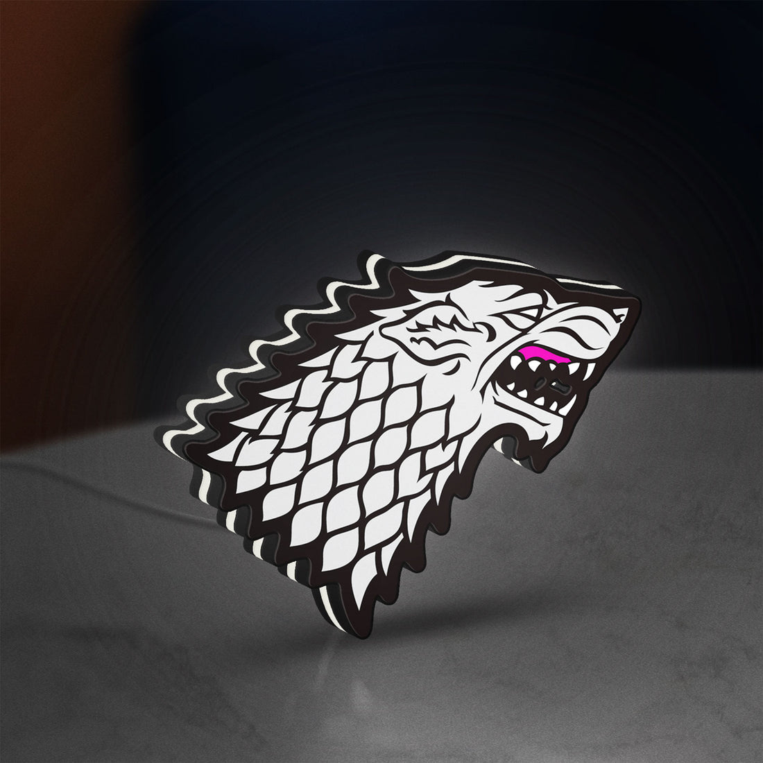 House Stark LED lightbox hanging on a wall with white glow