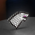 House Stark LED lightbox standing on a desk from an angled side view with white glow