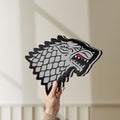 Unlit House Stark LED lightbox held by hand to show size and details