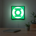 Green Lantern Corps LED lightbox hanging on a room wall with soft green light