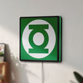 Unlit Green Lantern Corps LED lightbox mounted on a wall in daylight