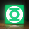 Front view of Green Lantern Corps LED lightbox sign glowing on a wooden desk