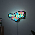 Space Jam LED lightbox hanging on a wall with green glow