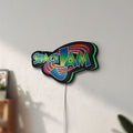 Unlit Space Jam LED lightbox mounted on a wall in daylight