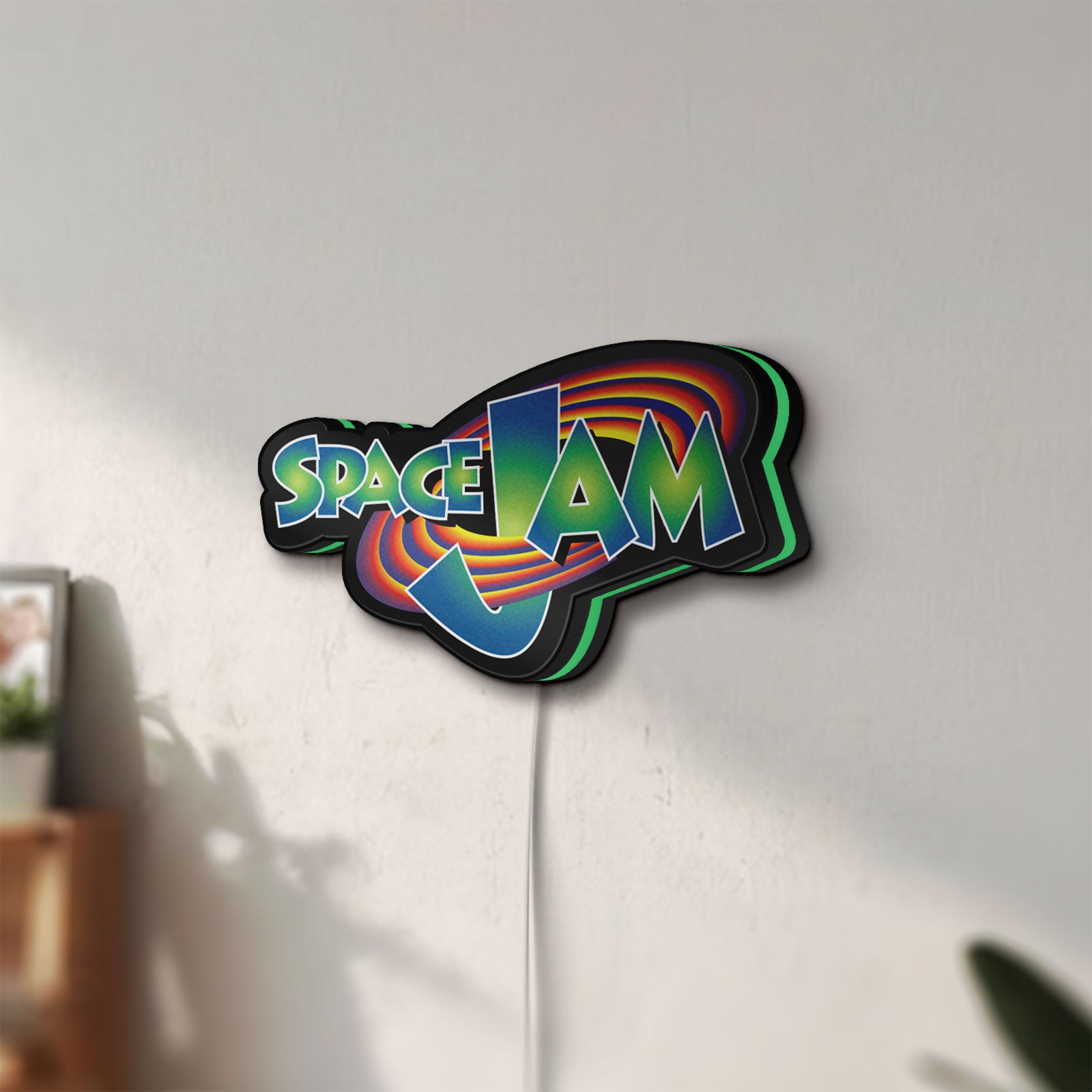 Unlit Space Jam LED lightbox mounted on a wall in daylight