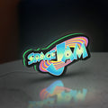 Space Jam LED lightbox standing on a desk from an angled side view with green glow