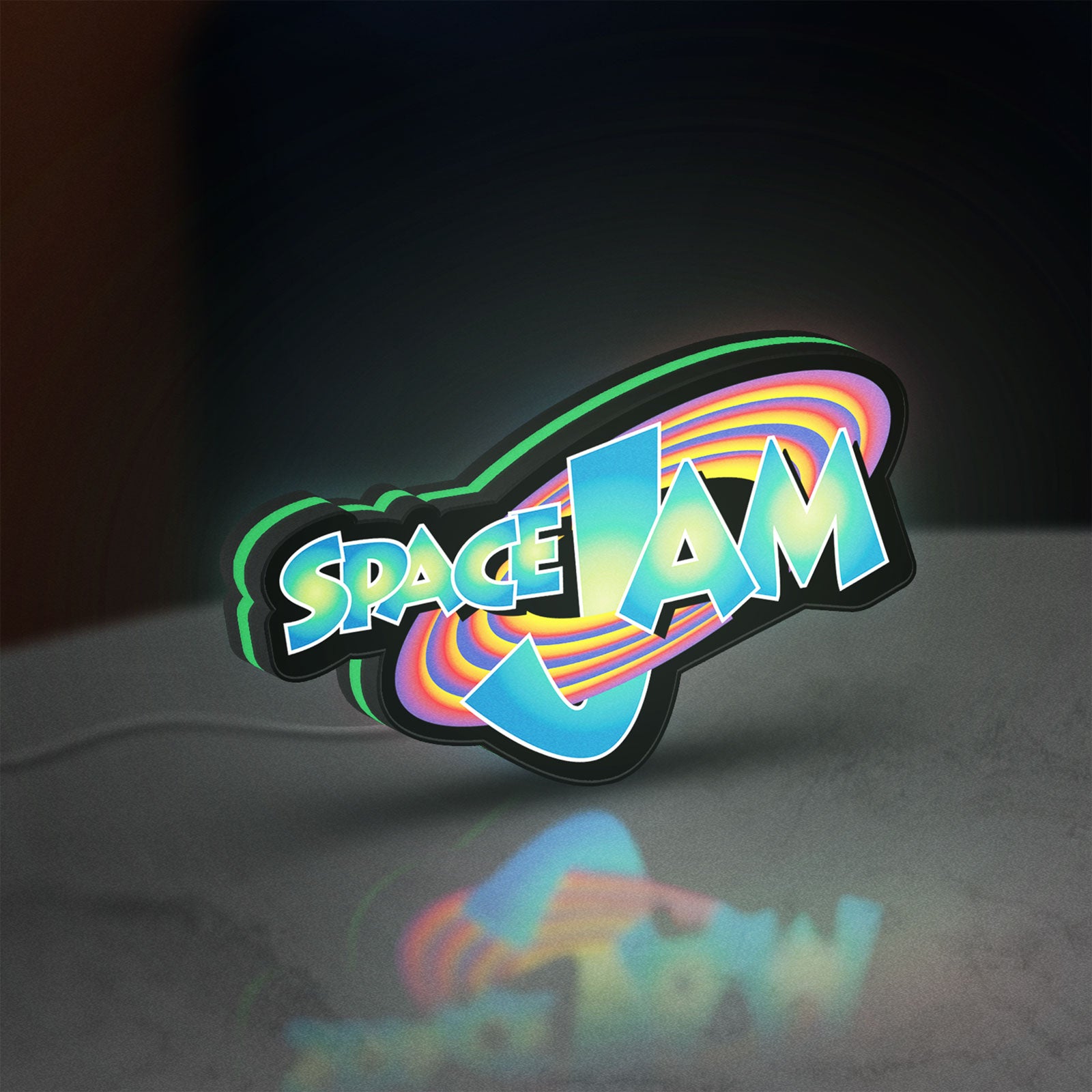 Space Jam LED lightbox standing on a desk from an angled side view with green glow