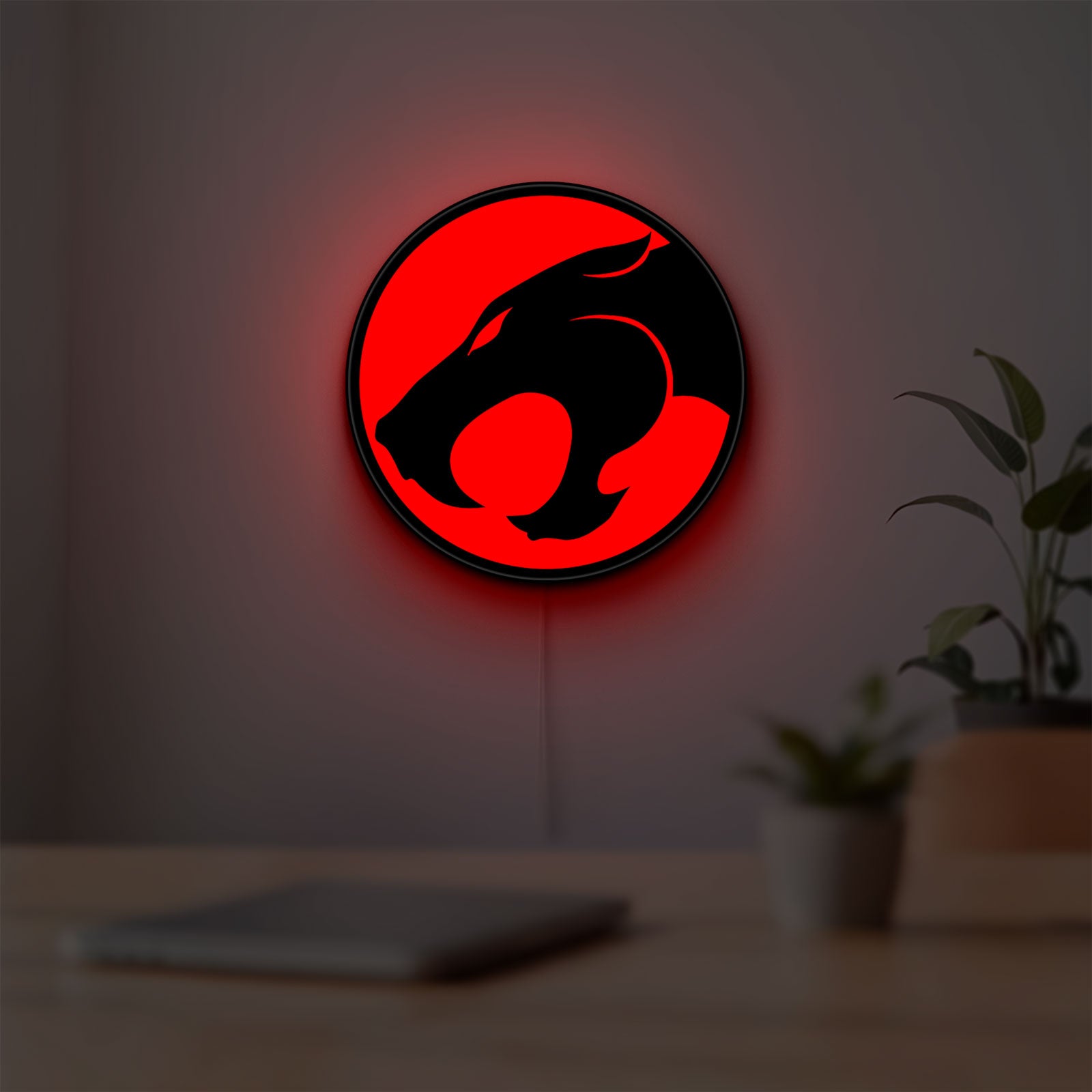 Thundercats 80s Retro LED lightbox hanging on a room wall with soft red light