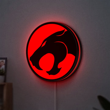 Thundercats 80s Retro LED lightbox hanging on a wall with red glow