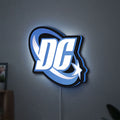 DC Comics LED lightbox hanging on a wall with blue glow
