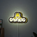 Garfield LED lightbox hanging on a wall with yellow glow