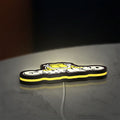 Garfield LED lightbox lying flat on a desk with yellow glow