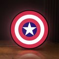 Front view of Captain America Shield LED lightbox sign glowing on a wooden desk