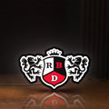 Front view of RBD LED lightbox sign glowing on a wooden desk