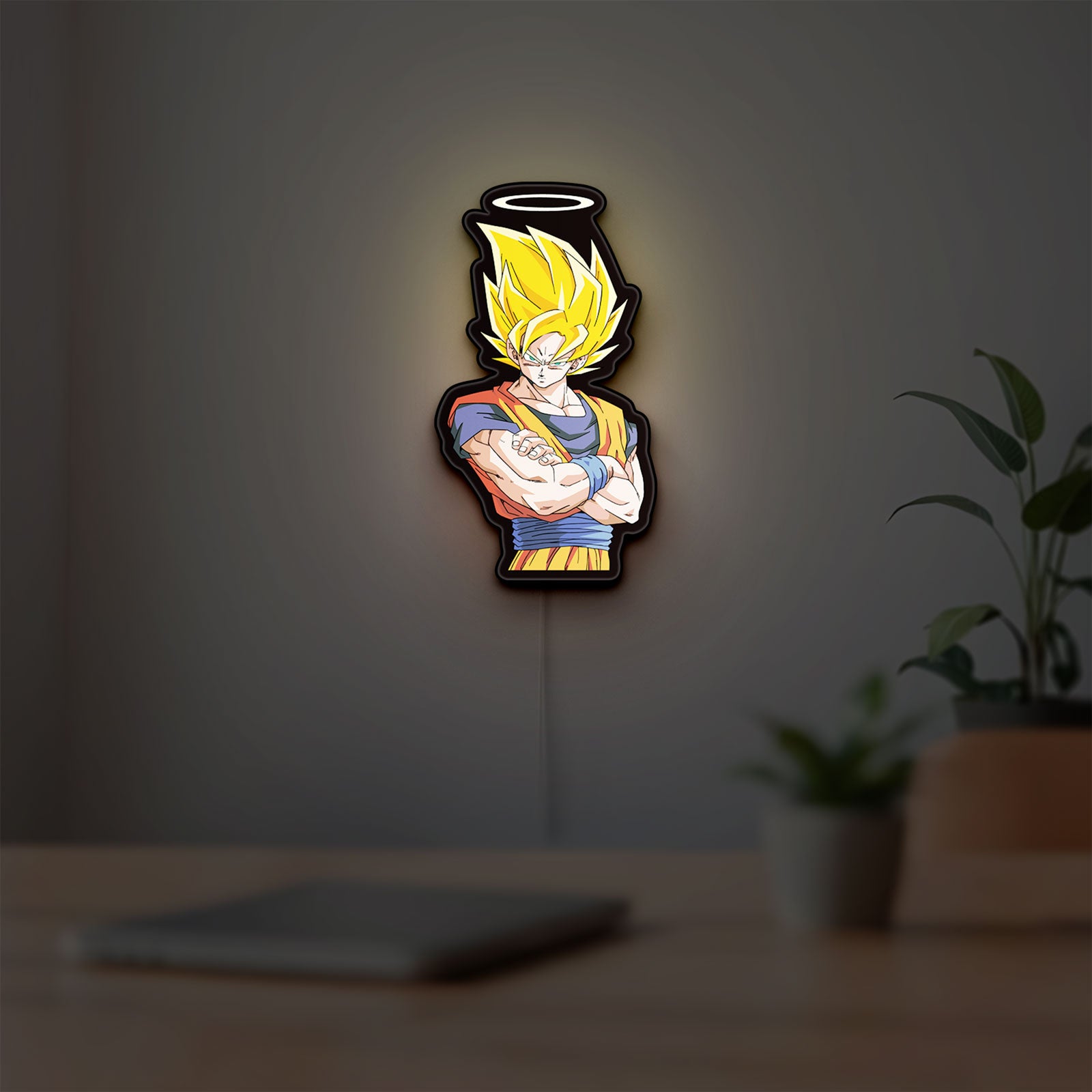 Dragon Ball Z Goku LED lightbox hanging on a room wall with soft yellow light