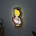 Dragon Ball Z Goku LED lightbox hanging on a wall with yellow glow