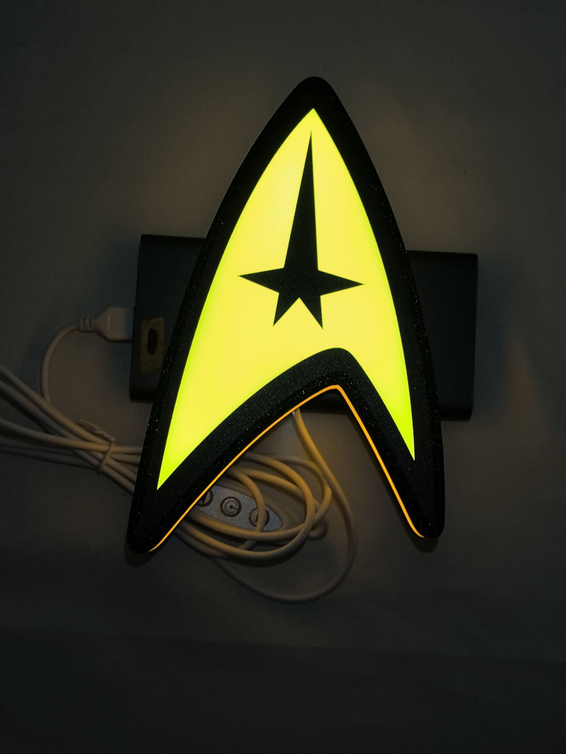 20cm Star Trek Command Insignia 3D Printed Sign - Illuminated flat lay front view, unique wall art for desk and room decor