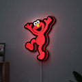 Elmo LED LED lightbox hanging on a wall with red glow