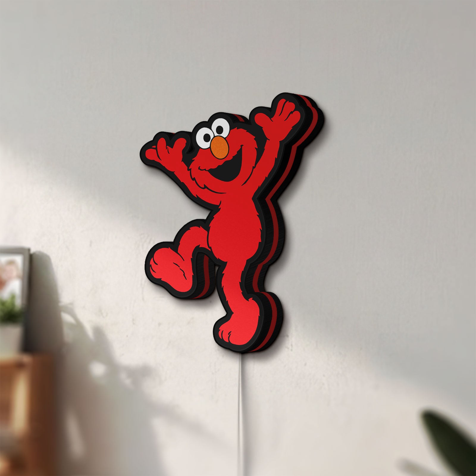 Unlit Elmo LED LED lightbox mounted on a wall in daylight