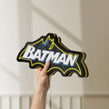 Unlit Batman LED lightbox held by hand to show size and details