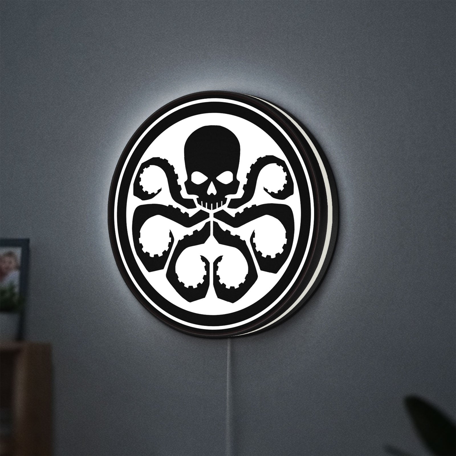 Hydra Agents of Shield LED lightbox hanging on a wall with white glow