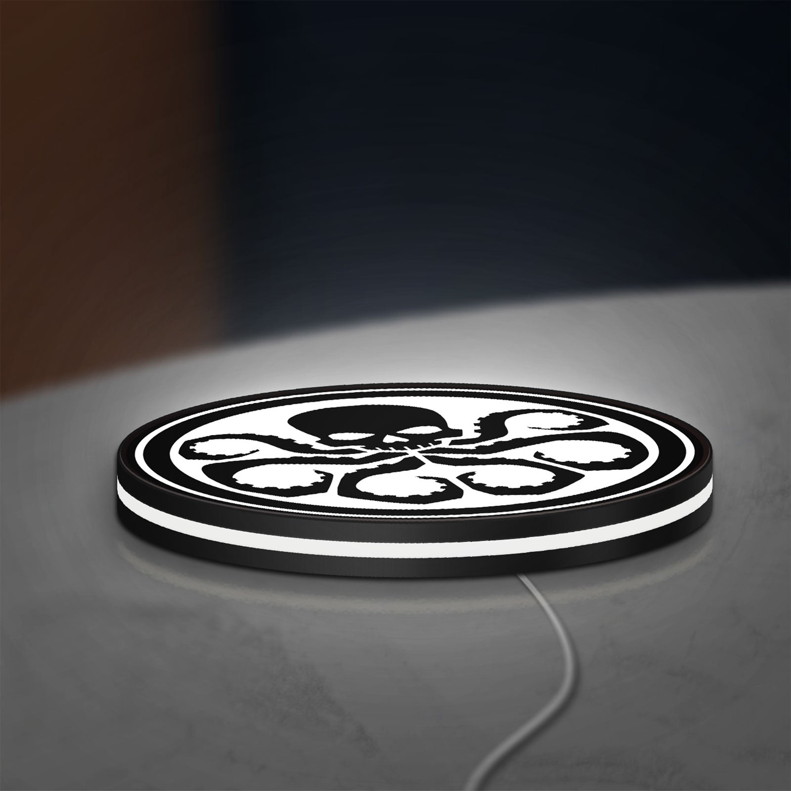 Hydra Agents of Shield LED lightbox lying flat on a desk with white glow