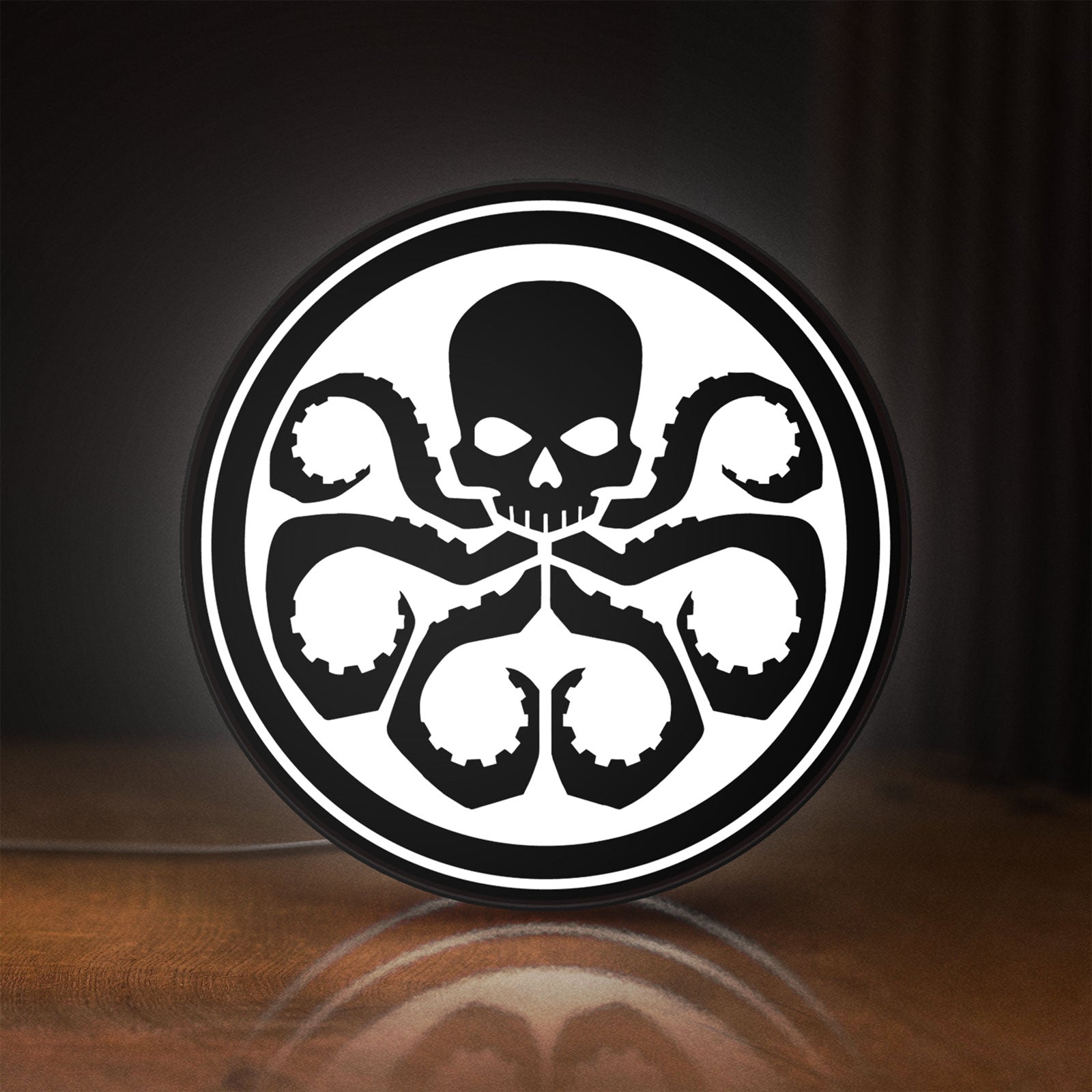 Front view of Hydra Agents of Shield LED lightbox sign glowing on a wooden desk