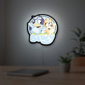 Bluey Inspired LED lightbox hanging on a room wall with soft white light