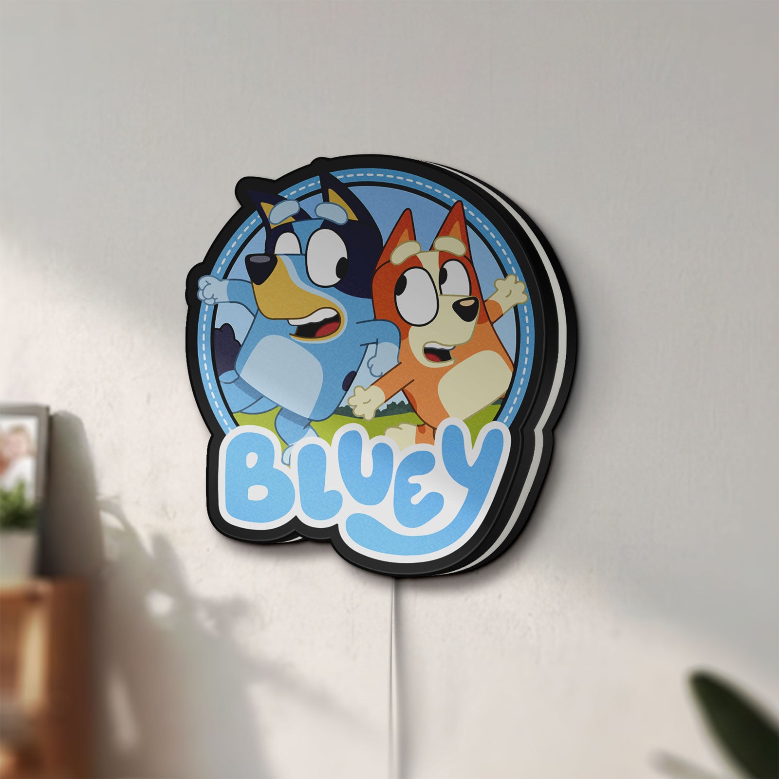 Unlit Bluey Inspired LED lightbox mounted on a wall in daylight