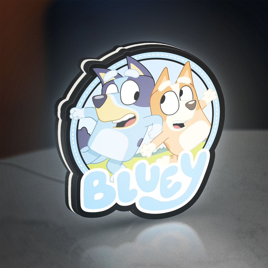 Bluey Inspired LED lightbox hanging on a wall with white glow
