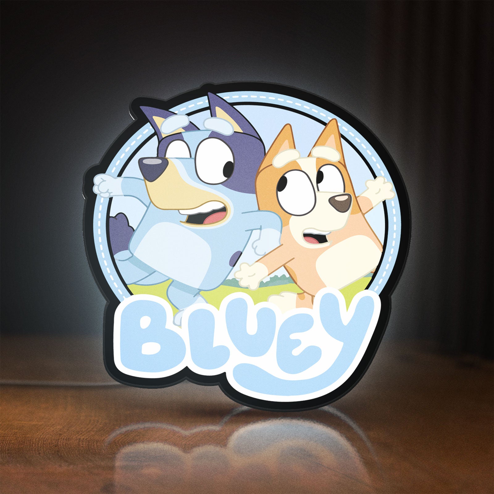 Front view of Bluey Inspired LED lightbox sign glowing on a wooden desk