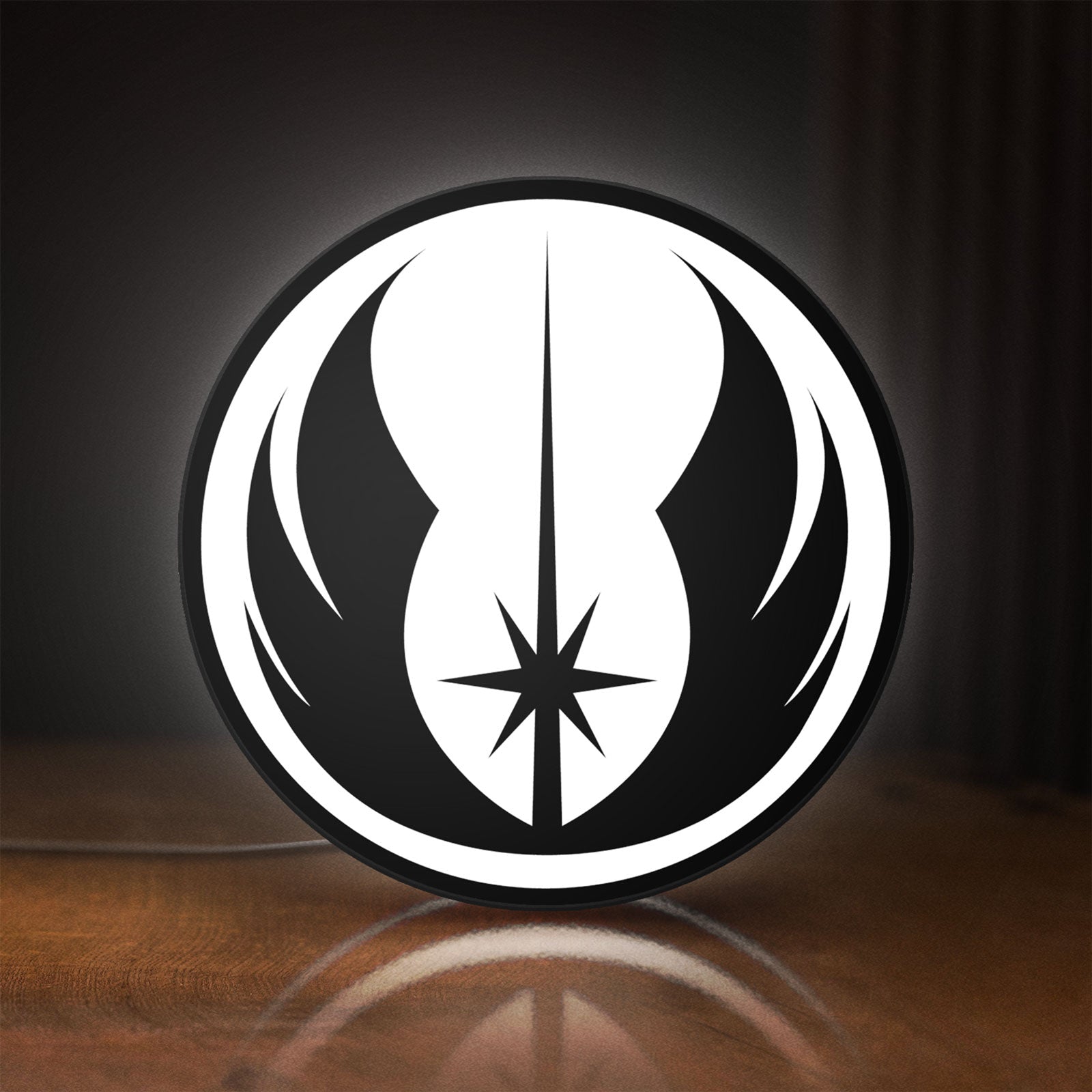 Front view of Star Wars LED lightbox sign glowing on a wooden desk