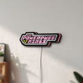 Unlit The Powerpuff Girls LED lightbox mounted on a wall in daylight