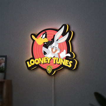 Looney Tunes LED lightbox hanging on a wall with yellow glow