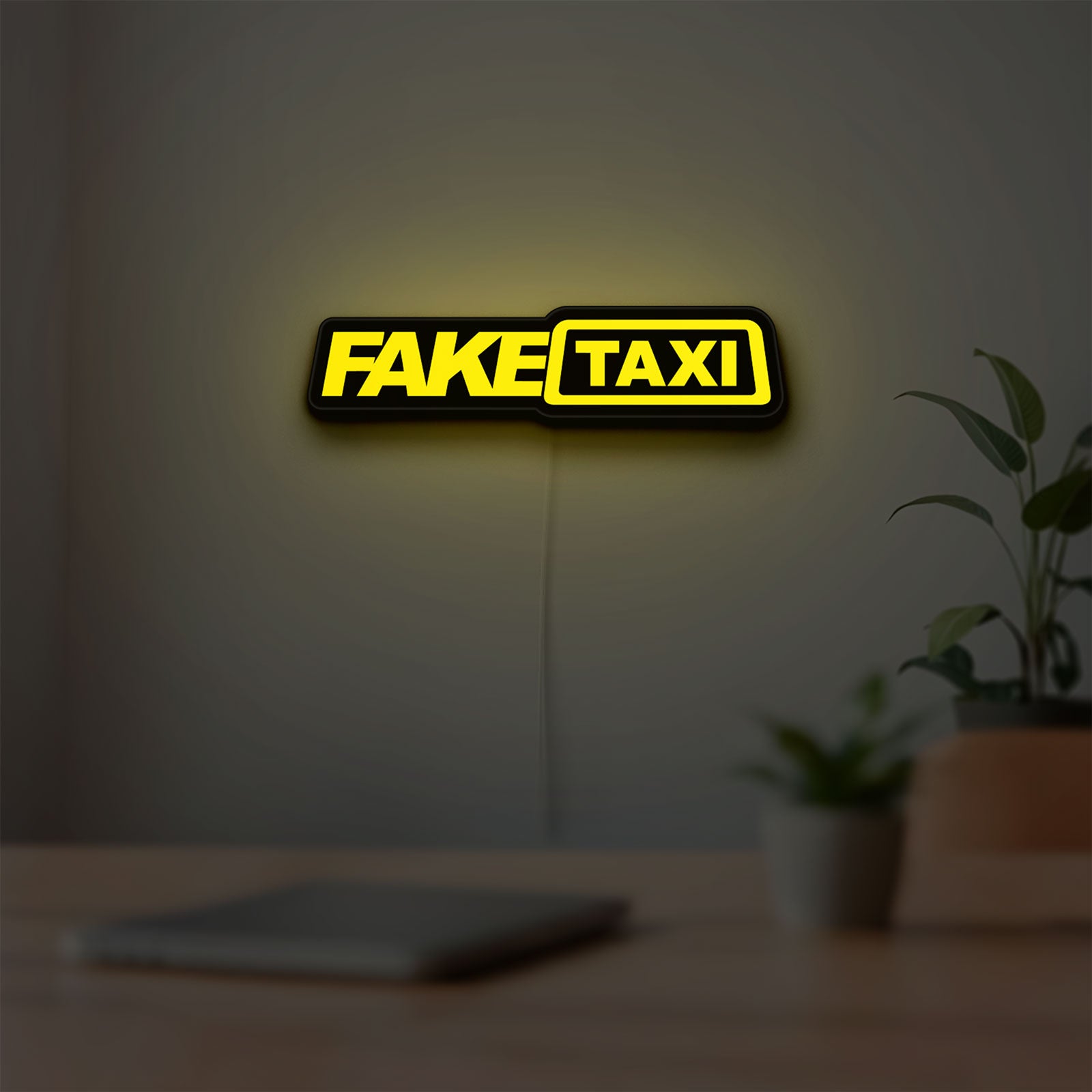 Fake Taxi LED lightbox hanging on a room wall with soft yellow light
