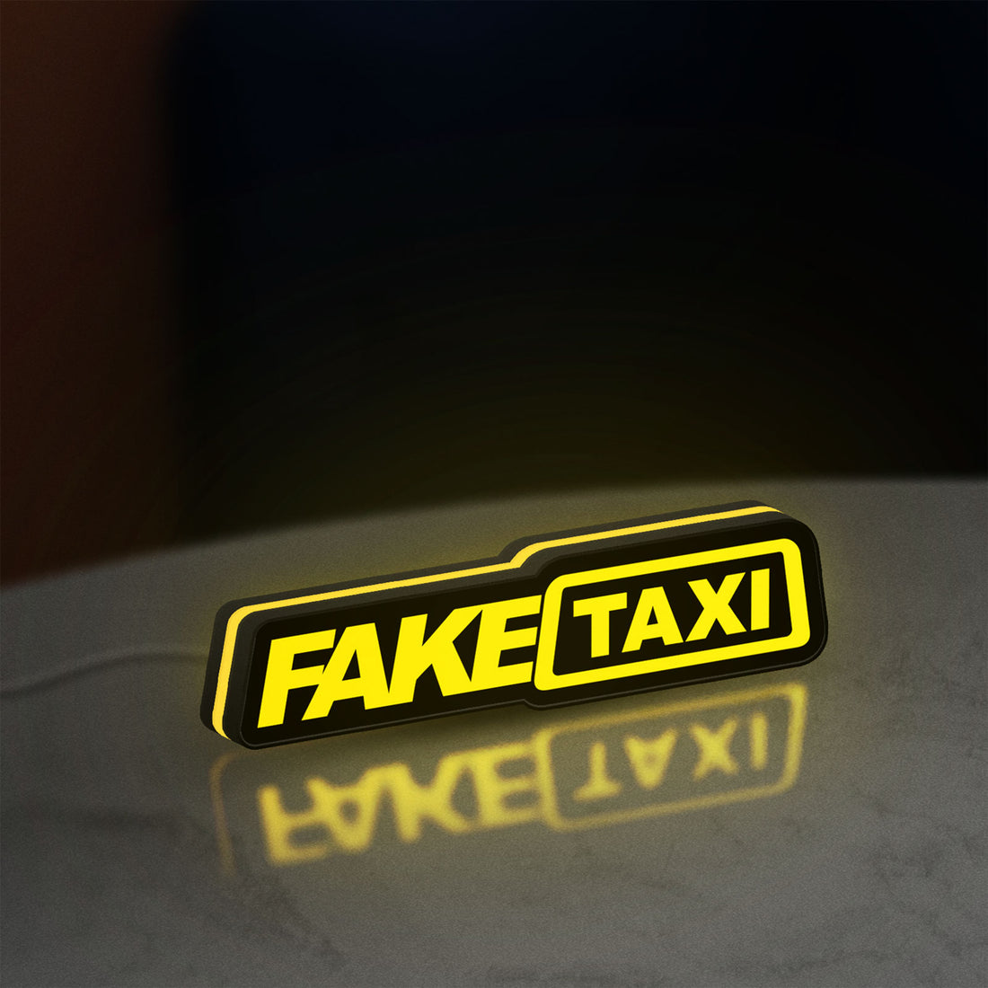 Fake Taxi LED lightbox hanging on a wall with yellow glow