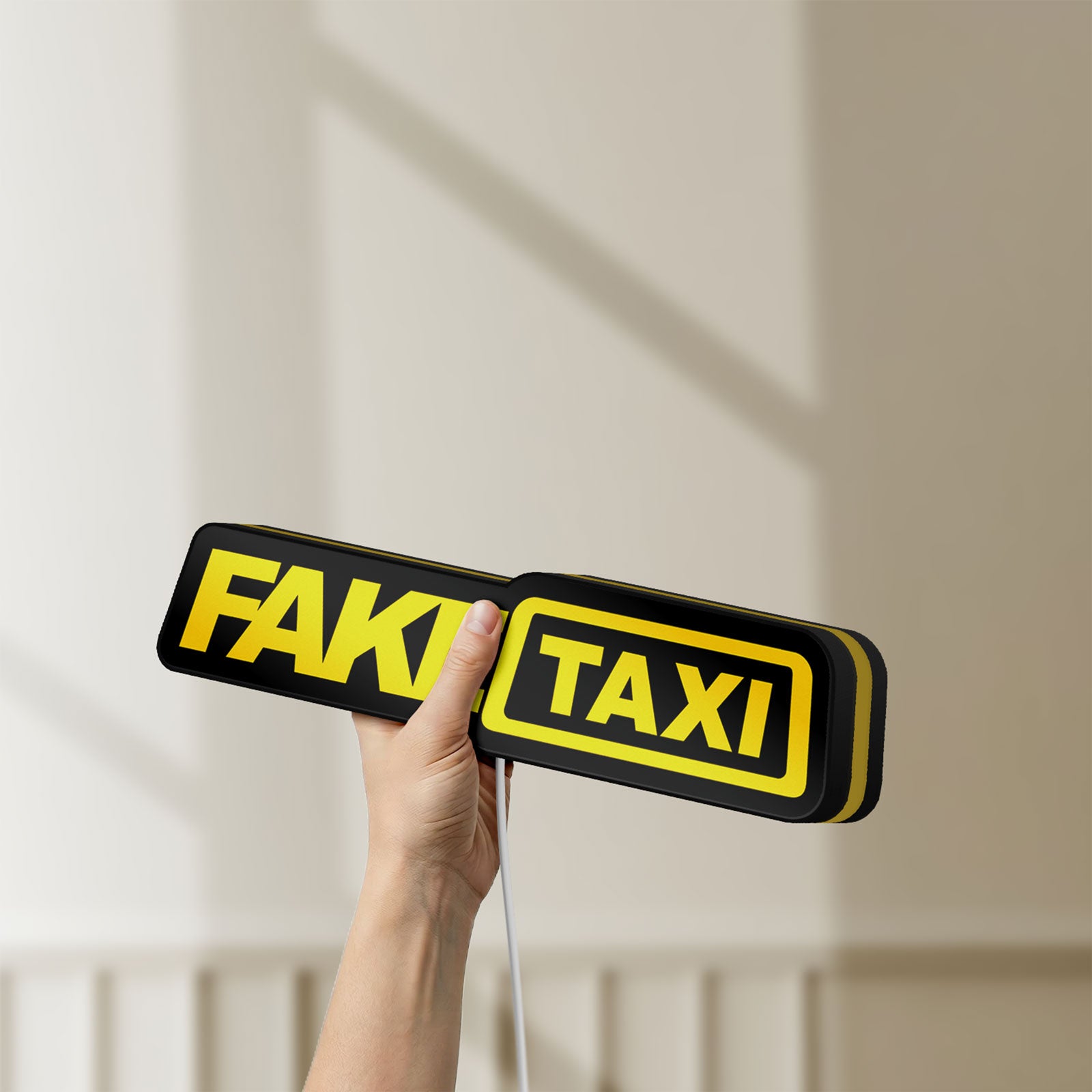 Unlit Fake Taxi LED lightbox held by hand to show size and details
