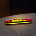 Lion King LED lightbox lying flat on a desk with yellow glow