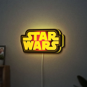 Star Wars LED lightbox hanging on a wall with yellow glow